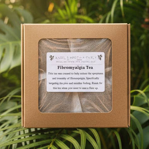 A square kraft paper box containing Fibermylga Tea with a clear front window and white label, centered among lush tropical green leaves.