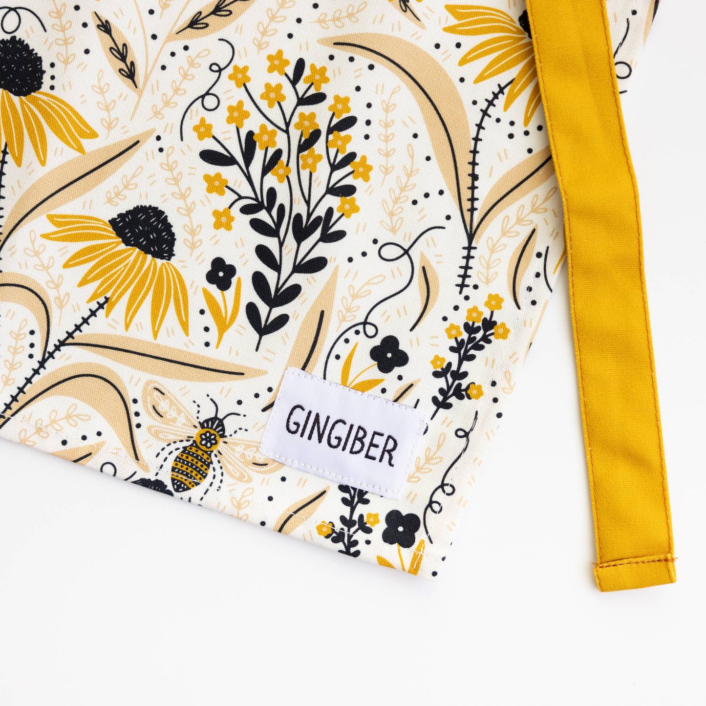 Fabric with floral pattern and 'GINGIBER' label on a white background