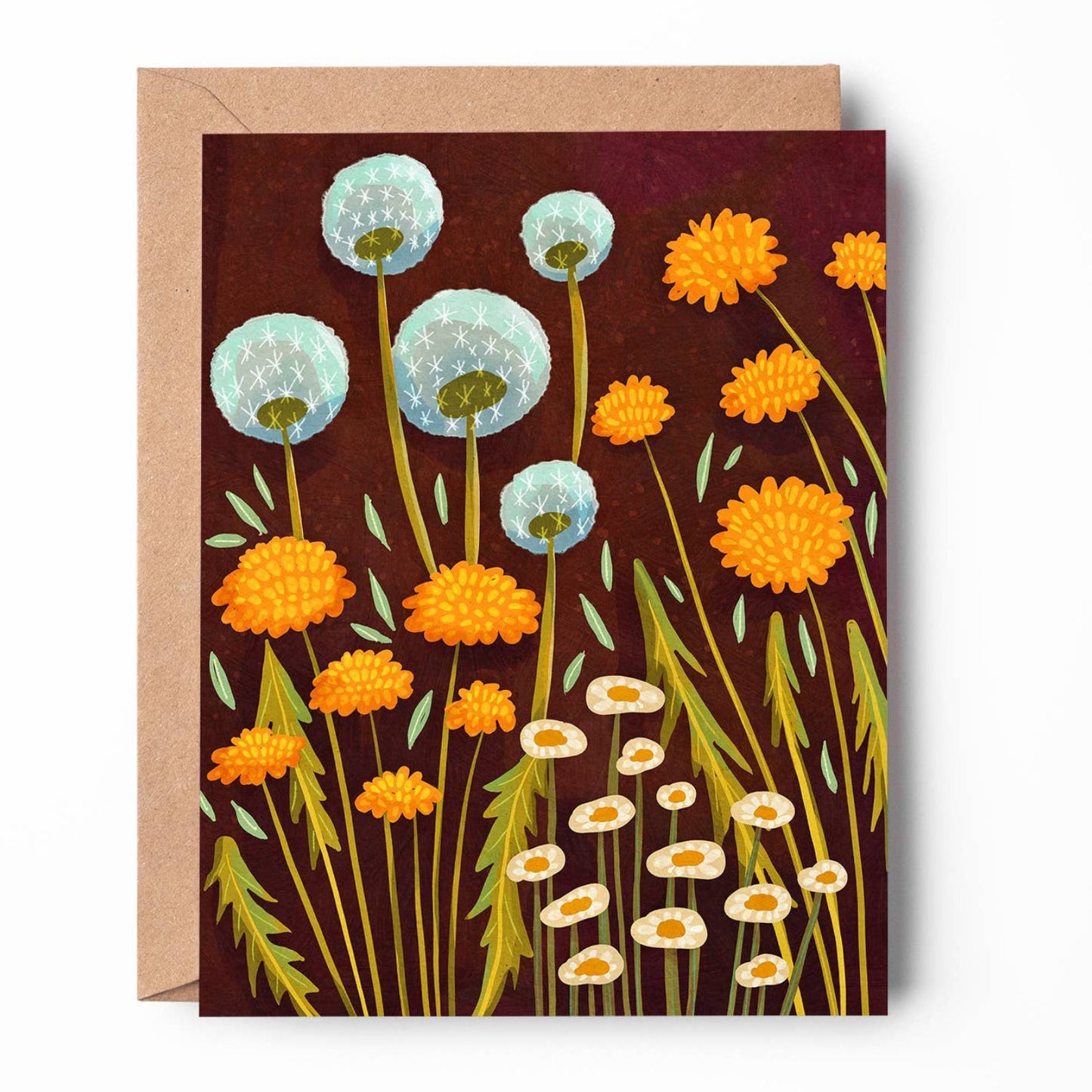 A square greeting card with a kraft envelope, featuring a stylized illustration of wildflowers including dandelions and marigolds on a dark reddish-brown background.