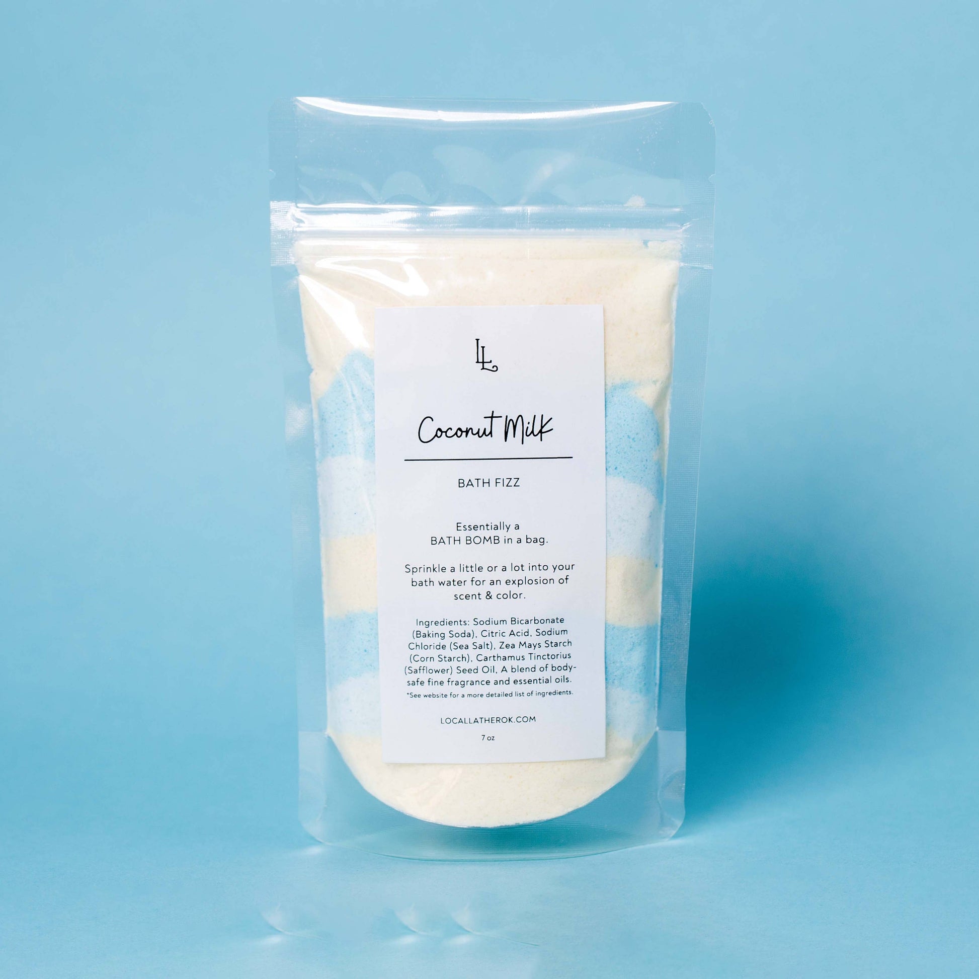 Packaged bath fizz on a light blue background