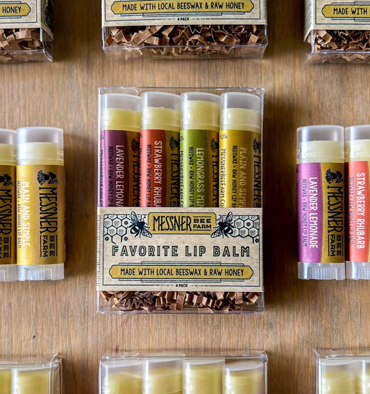 Collection of Messner lip balms on a wooden surface