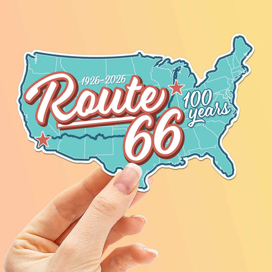 Sticker of Route 66 with a map outline held by a hand on a peach background