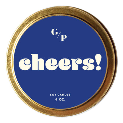 Candle lid with 'G/P cheers!' text on a blue background